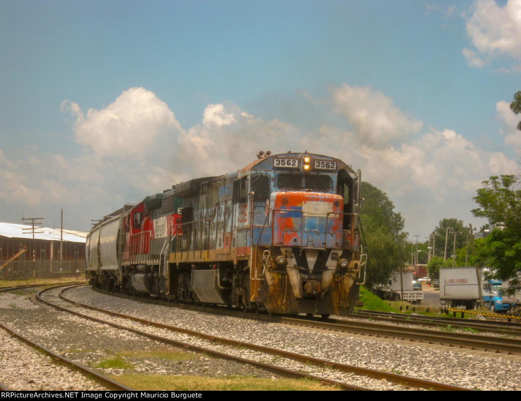 FXE C30-7 Locomotive leading a train